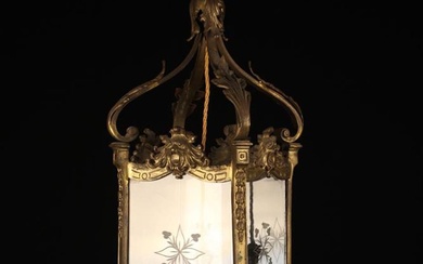 An Early 20th Century Hanging Hall Lantern. The square gilt metal frame with etched glass panel side