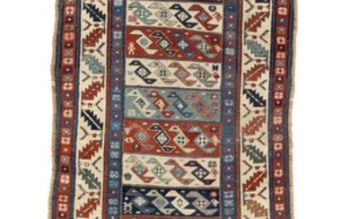 An antique Caucasian tribal rug from the Moghan tribe. Design with horisontal bands with “Syrga Nagisch”(stylised bird) motifs. 19th century. 225×96 cm.