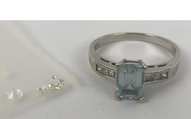 An aquamarine ring, and assorted loose white stones