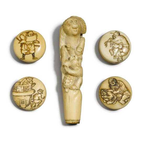 An ivory cane handle and four manju, Meiji period, late 19th century