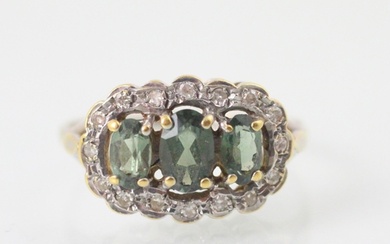 An untested green tourmaline and diamond triple cluster ring...