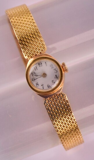 Bracelet montre de femme en or 750/1000, cadran rond émaillé...