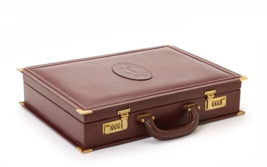 SOLD. Cartier: A briefcase of burgundy leather with gold tone hardware, short hadle and one compartment with three pockets. – Bruun Rasmussen Auctioneers of Fine Art