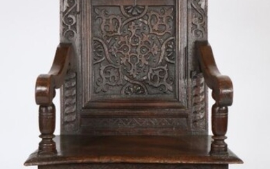 Charles I joined oak panel-back open armchair, West Country, circa 1640,, having an ornately