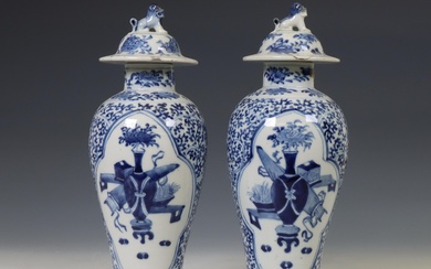 China, a pair of blue and white porcelain baluster vases and covers, 19th century