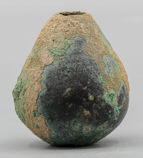 Copper mace-head. A copper piriform mace-head, with a central...