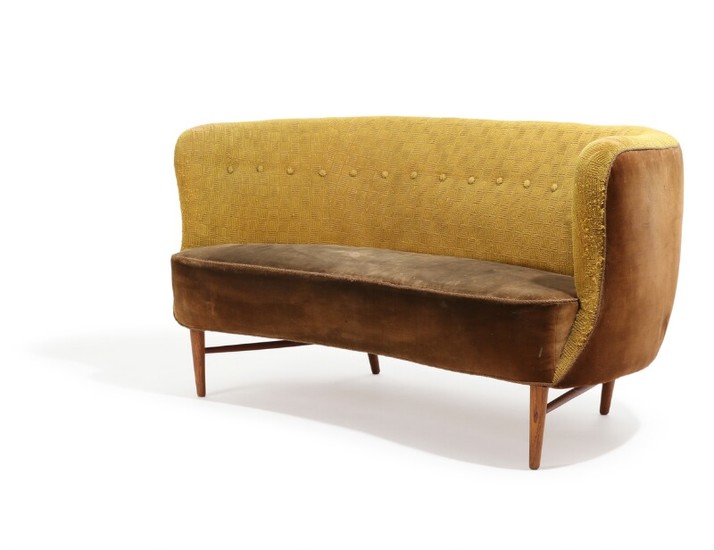 Danish furniture design: A 1940–50s banana shaped sofa, upholstered with velvet and yellowish fabric, patinated oak legs. L. 146 cm.