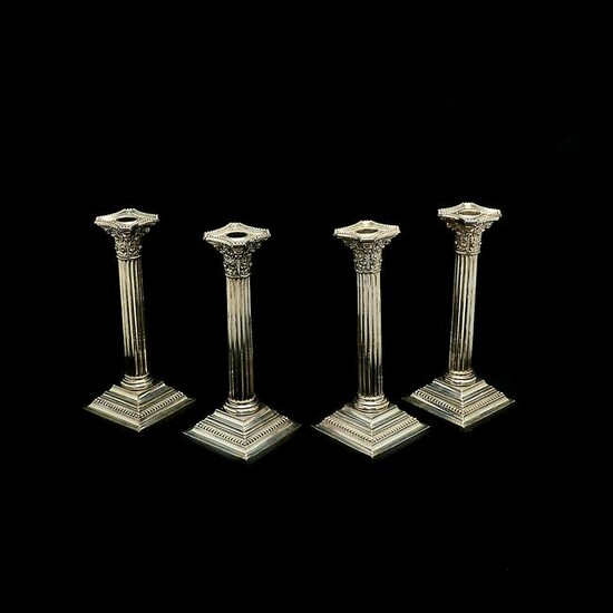 Four Gorham Sterling Silver Columnar Candlesticks.