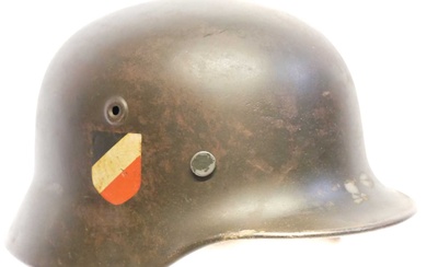 German WWII M40 helmet, with reproduction liner and pins, stamped...