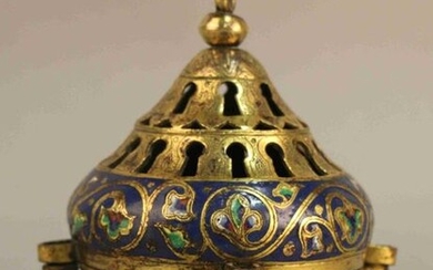 INCENSE with four openwork gilt bronze passageways decorated with foliated scrolls in polychrome enamels. Round base. Old Italian work. Height : 14 cm Diameter : 11 cm