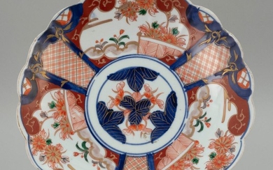 JAPANESE IMARI PORCELAIN PLATE Floriform, with three floral cartouches around the sides. Diameter 11".