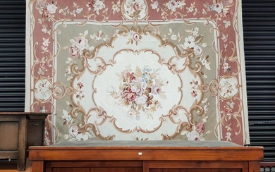 Large Aubusson Type Tapestry, with large floral spray & scroll frame, on a cream field and pink border