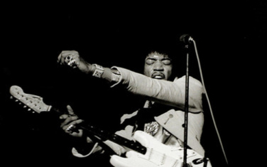 Linda McCartney (American, b.1941-d.1998): Jimi Hendrix playing guitar in New York, 1967