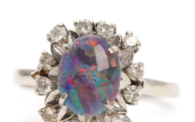 Opal and diamond ring set with opal triplet encircled by numerous brilliant-cut diamonds. Size 56. Weight app. 4.5 g.