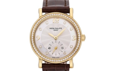 Patek Philippe Reference 4959J-001 | A yellow gold and diamond-set wristwatch with mother-of-pearl dial, Circa 2010
