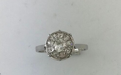 Platinum cushion ring set with a cushion of TA diamonds, circa 1950, TD 56, Gross Weight: 4g