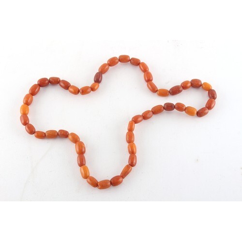 Property of a deceased estate - an amber bead necklace, two ...