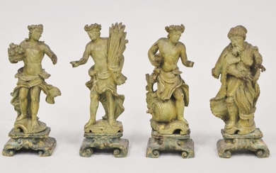 Quatre sculptures en peuplier peint façon bronze représentant les quatre saisons. 1ère moitié du XVIIIe...