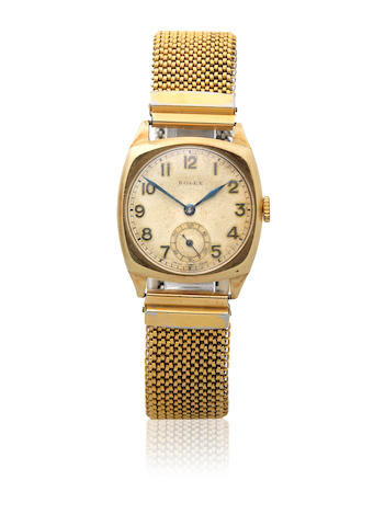 Rolex. A 9K gold manual wind cushion form bracelet watch