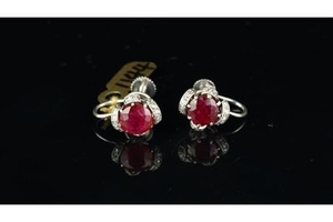 Ruby and diamond screw back ear clips, set in unmarked white metal, central round ruby with diamond set surround to each...