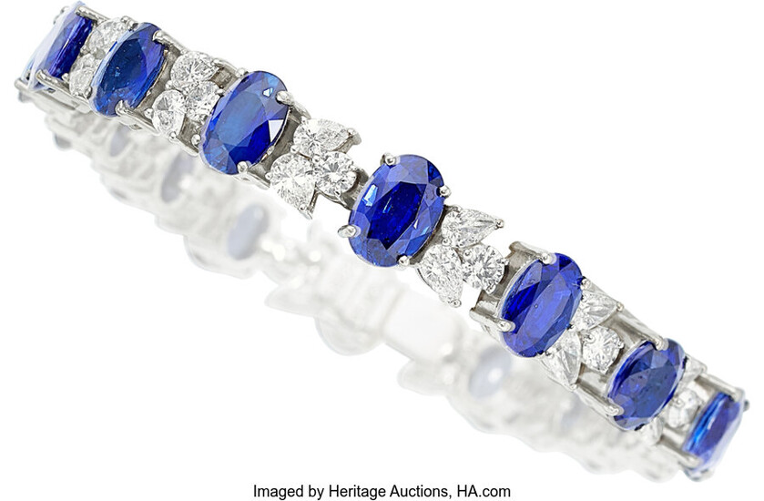 Sapphire, Diamond, White Gold Bracelet The bracelet features oval-shaped...