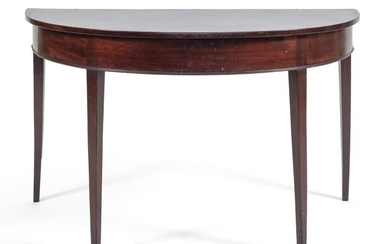 HEPPLEWHITE-STYLE DEMILUNE TABLE In mahogany. Height 28.5". Width...