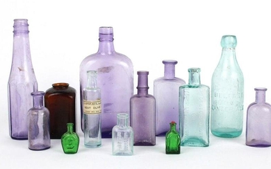 Thirteen Vintage Colored Glass Bottles