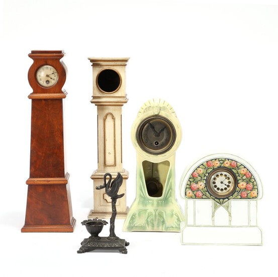 NOT SOLD. Two Jugend majolica clocks and three pocket watch holders. H. 16-40 cm. (5)...