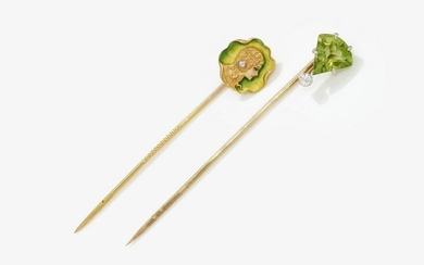Two tie pins with woman's head and peridot
