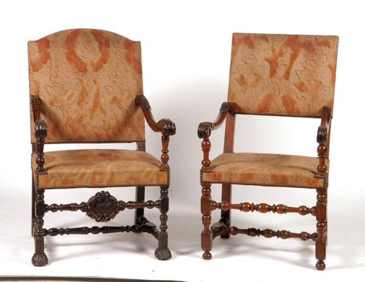 Two walnut armchairs carved with acanthus leaves. One decorated with...