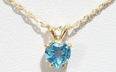 14K yellow gold necklace and pendant inlaid with a natural blue topaz stone in the shape of a new heart....