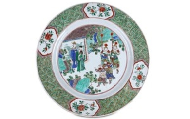 A LARGE CHINESE FAMILLE VERTE FIGURATIVE DISH. Qing...