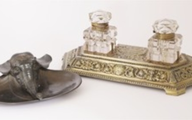 An unusual Indian bronzed metal inkwell in the form of an elephant head