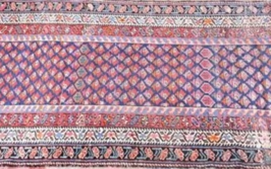 A large Afghan hall runner the central field with repeating geometric shapes within a stepped border, 342 cm x 110 cm....