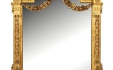 A Louis XVI Style Carved Giltwood Mirror
