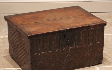 A 17th century oak bible/carriage box, the hinged cover over...
