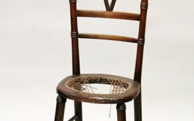 A 19TH CENTURY CHILD'S BEECH CORRECTION CHAIR 3ft 2ins