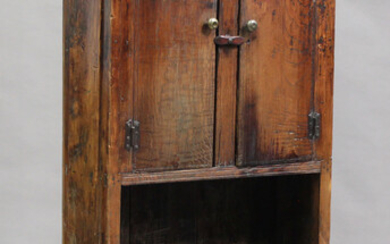 A 19th century Spanish elm side cupboard, fitted with two doors above an open shelf, height 177cm, w