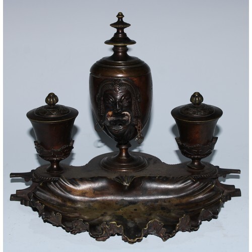 A 19th century patinated bronze inkstand, central ovoid lamp...