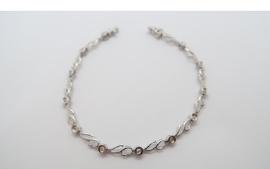 A 9ct white gold and diamond line bracelet - approx weight 3...