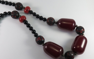 A BLACK AGATE, CORAL, CARVED LACQUER AND 'AMBER' COMPOSITION BEAD NECKLACE
