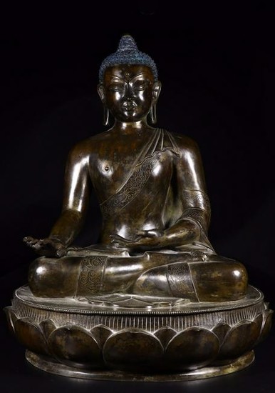 A BRONZE FIGURE OF SAKYAMUNI BUDDHA