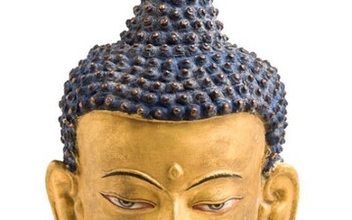 A BRONZE GILT-BRONZE HEAD OF BUDDHA, TIBET, 19TH CENTURY...