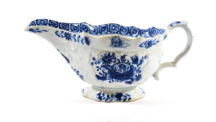 A Bow Porcelain Sauce Boat, circa 1765, painted in underglaze...
