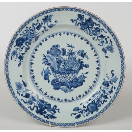 A Chinese 18th century blue and white charger. Painted in un...