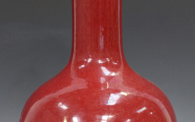 A Chinese sang-de-boeuf glazed porcelain bottle vase, Qing dynasty, the globular body with cylindric