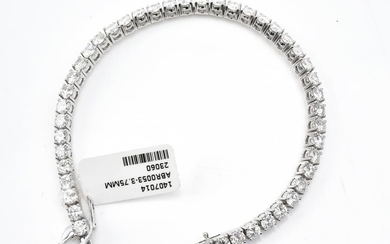 A DIAMOND LINE BRACELET - featuring forty four round brilliant cut diamonds totalling 8.08ct, set in four claw settings in 18ct whit...