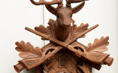 A GERMAN CUCKOO CLOCK WITH APPLIED WITH CARVED HUNTING TROPHIES, APPROXIMATELY 81 CM OVERALL HEIGHT