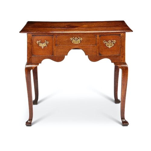 A George I oak lowboy The rounded rectangular top above a fr...