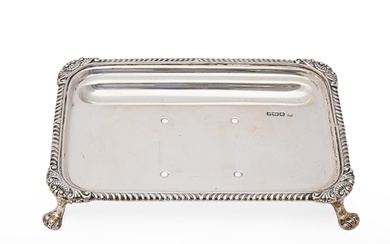 A George V silver inkstand, with gadrooned rim, 17cm l, by J...